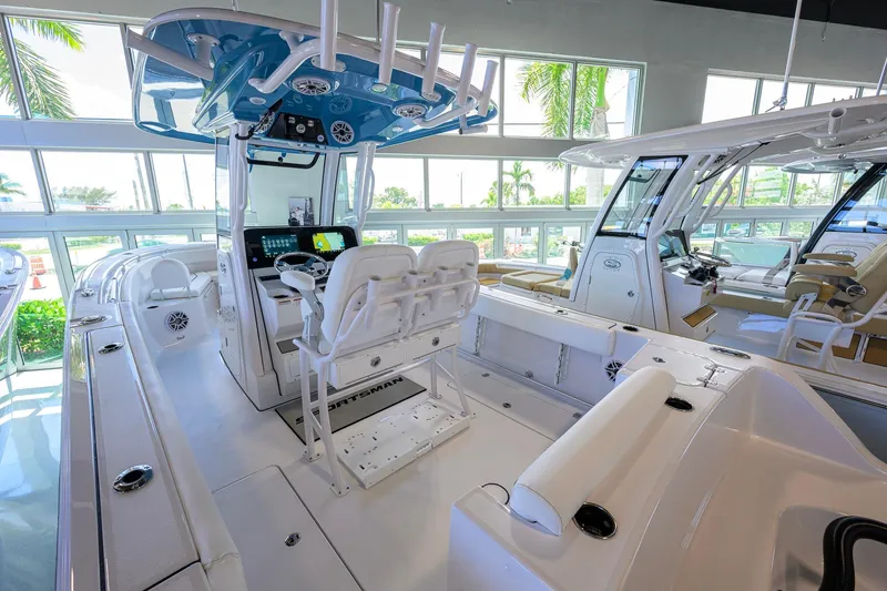 Slide: The Image of 2026 Sportsman Open 252 Center Console boat interior with modern helm and seating. - 34