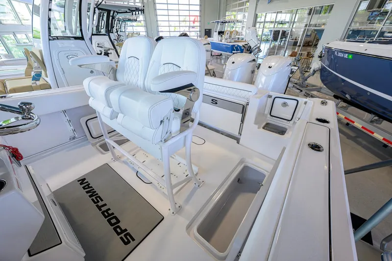 Slide: The Image of 2026 Sportsman Open 252 Center Console boat interior with dual seating and modern design. - 38