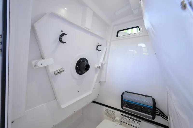Slide: The Image of Interior of 2026 Sportsman Open 252 Center Console boat, featuring storage and equipment. - 41