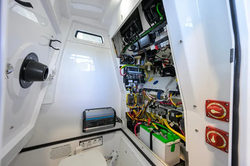 Slide: The Image of Interior view of 2026 Sportsman Open 252 Center Console's electrical system and wiring. - 44