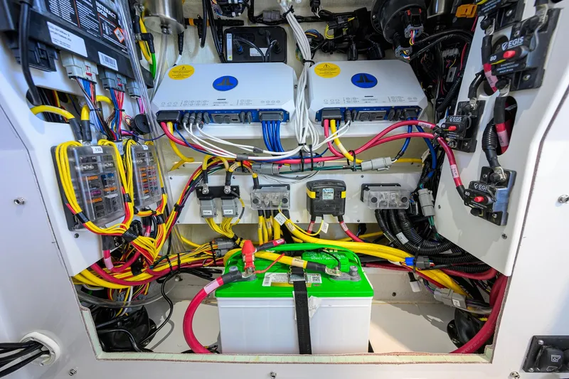Slide: The Image of Electrical system of a 2026 Sportsman Open 252 Center Console boat, featuring wiring and battery. - 45