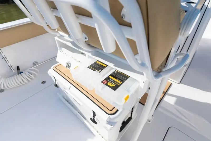 Slide: The Image of 2026 Sportsman Open 252 Center Console boat interior with storage and seating. - 8