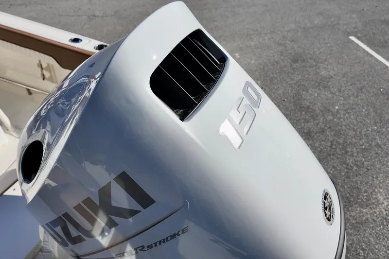 Slide: The Image of Outboard motor on 2026 Pioneer 202 Islander boat, featuring Suzuki 150 horsepower engine. - 17