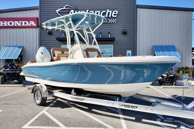 Slide: The Image of 2026 Pioneer 202 Islander boat on trailer outside dealership. - 20