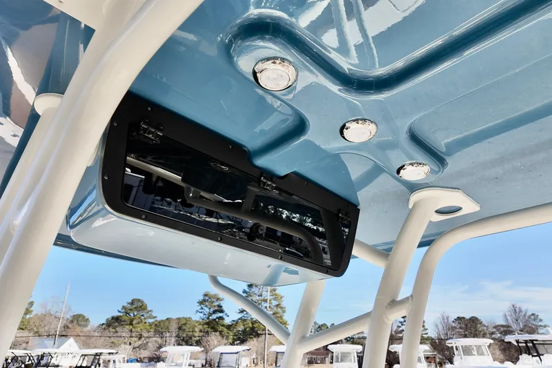 Slide: The Image of 2026 Pioneer 202 Islander boat with blue T-top and integrated lighting. - 5