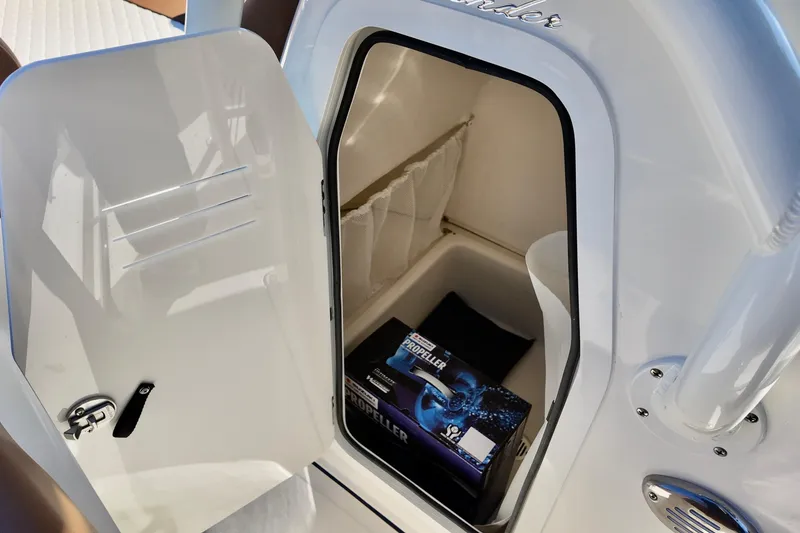 Slide: The Image of Open storage compartment in 2026 Pioneer 202 Islander boat with propeller box inside. - 7