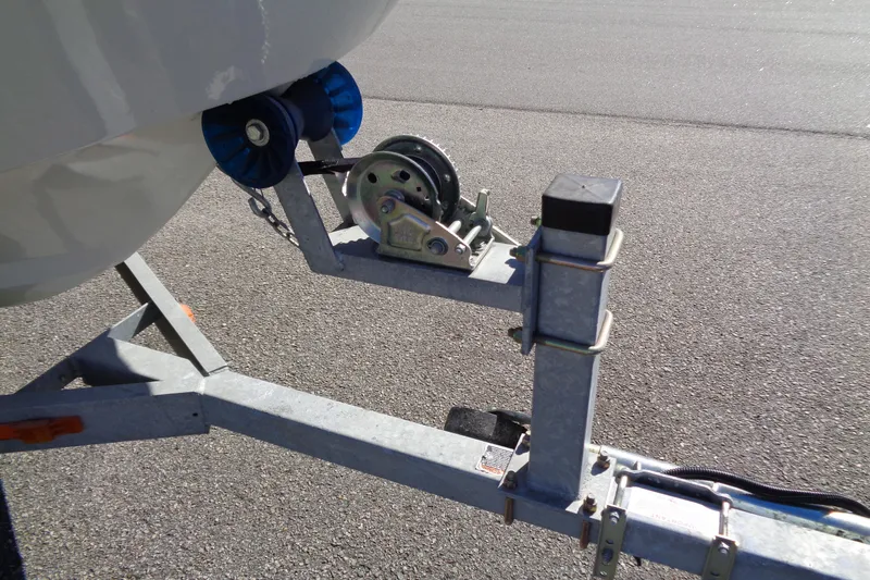 Slide: The Image of Trailer hitch of a 1987 Boston Whaler Montauk 17' CC on asphalt. - 17