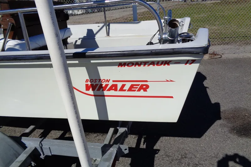 Slide: The Image of 1987 Boston Whaler Montauk 17' CC boat on trailer, side view. - 3