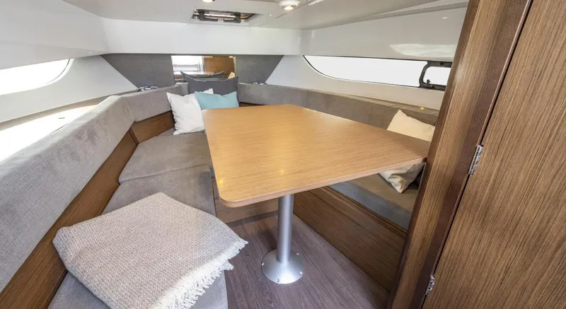 Slide: The Image of Interior of 2023 Beneteau Flyer 9 SUNdeck with dining table and seating area. - 11