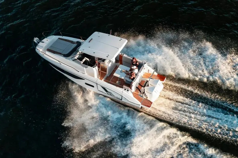 Slide: The Image of 2023 Beneteau Flyer 9 SUNdeck cruising on water, aerial view. - 15