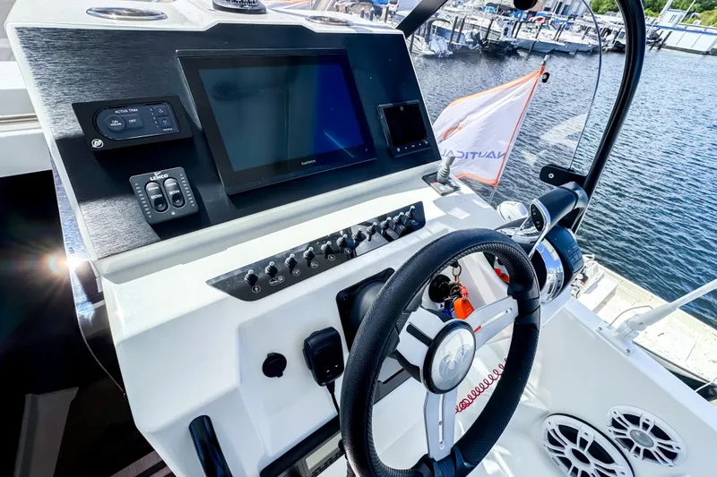 Slide: The Image of Beneteau Flyer 9 SUNdeck 2023 helm at the marina. - 16
