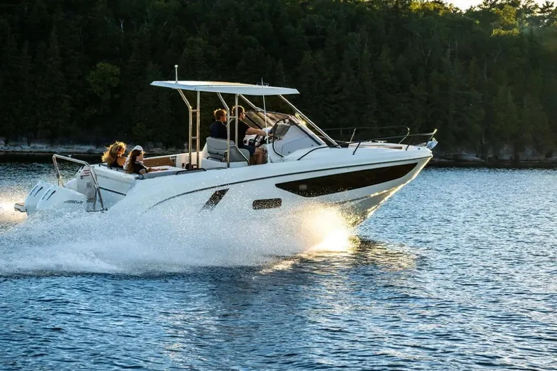 Slide: The Image of 2023 Beneteau Flyer 9 SUNdeck cruising on a scenic lake with passengers onboard. - 27