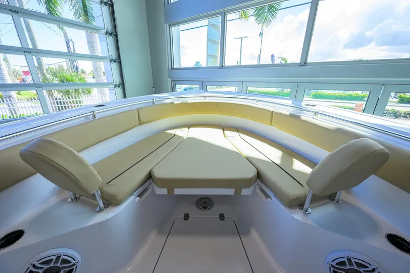 Slide: The Image of 2026 Sportsman Open 232 Center Console boat interior with cushioned seating and modern design. - 13