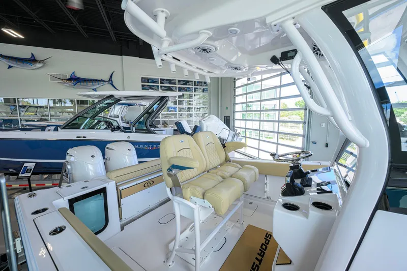 Slide: The Image of 2026 Sportsman Open 232 Center Console boat interior with dual engines and seating. - 24