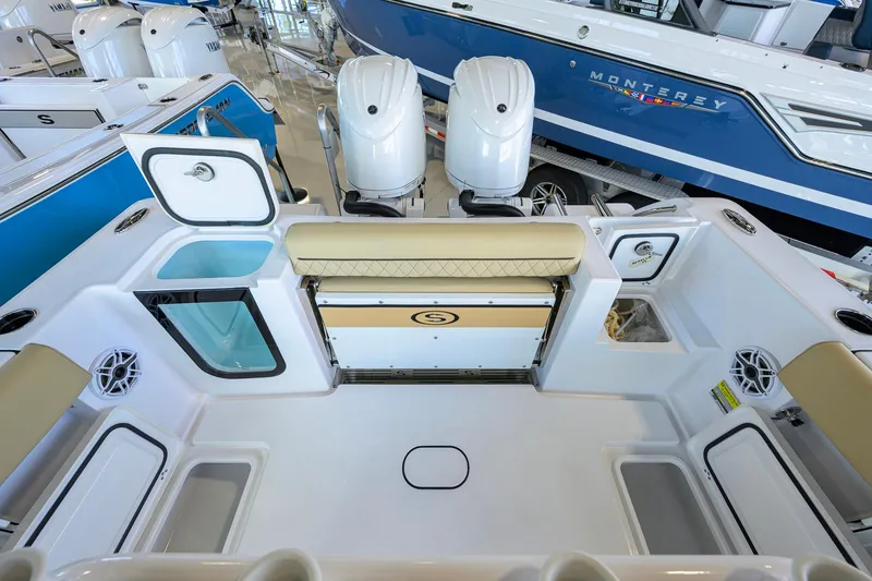 Slide: The Image of 2026 Sportsman Open 232 Center Console boat interior with dual engines and seating. - 28