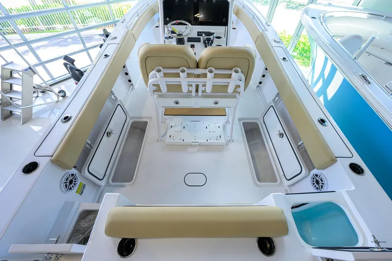 Slide: The Image of 2026 Sportsman Open 232 Center Console boat interior with seating and storage compartments. - 31