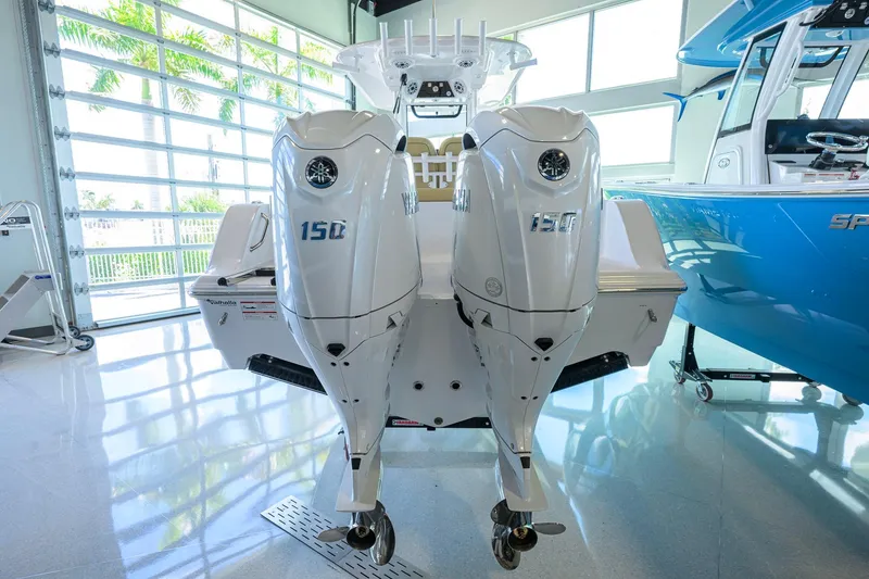 Slide: The Image of 2026 Sportsman Open 232 Center Console with dual 150 horsepower engines in showroom. - 48