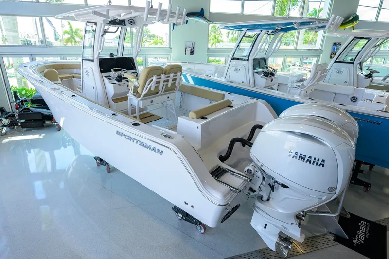 Slide: The Image of 2026 Sportsman Open 232 Center Console boat with Yamaha engines in showroom. - 50