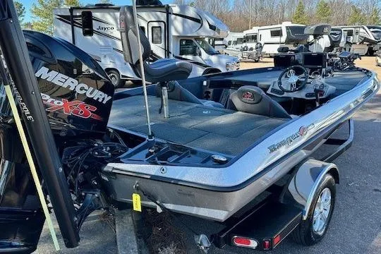 Slide: The Image of 2017 Ranger Z185 boat with Mercury engine, parked near RVs. - 12