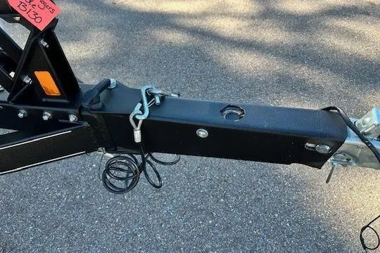 Slide: The Image of Trailer hitch of 2017 Ranger Z185 on asphalt background. - 2