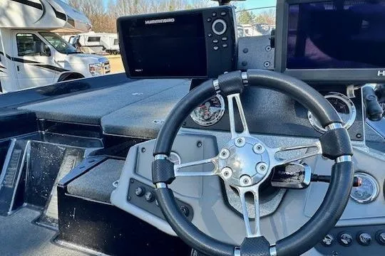 Slide: The Image of Steering wheel and dashboard of 2017 Ranger Z185 boat with electronic displays. - 3