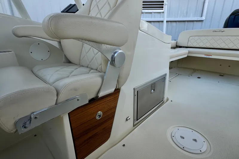 Slide: The Image of 2017 Chris-Craft Calypso 26 interior with luxurious seating and storage features. - 15