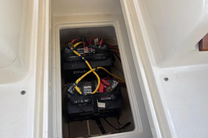 Slide: The Image of Battery compartment of 2017 Chris-Craft Calypso 26 boat with DieHard batteries. - 30