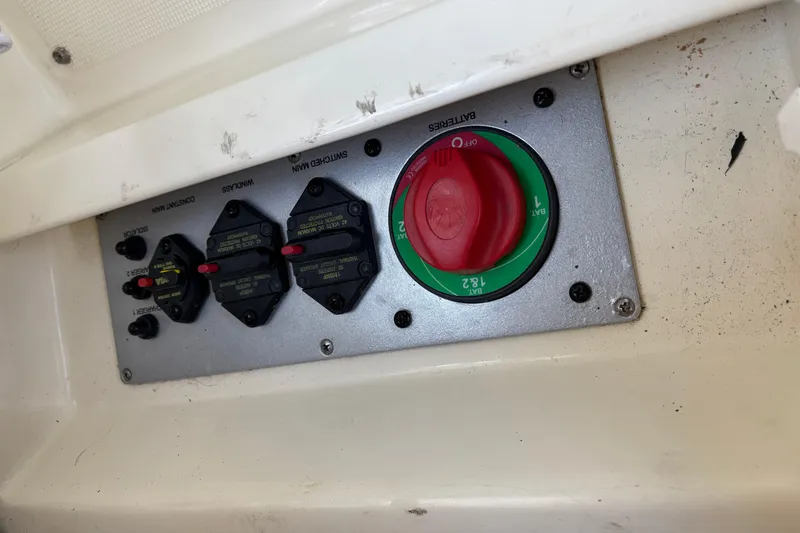 Slide: The Image of Control panel of 2017 Chris-Craft Calypso 26 boat with switches and battery selector. - 31