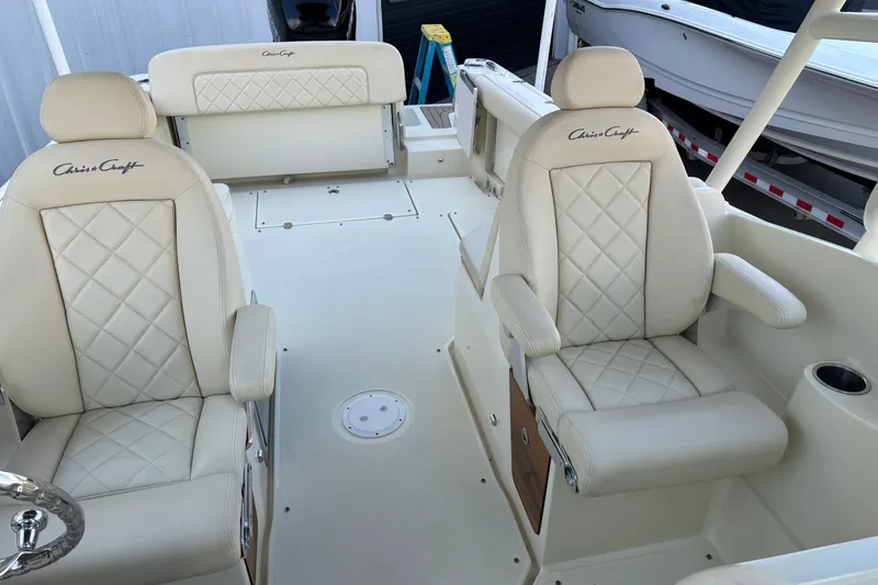 Slide: The Image of 2017 Chris-Craft Calypso 26 boat interior with luxurious cream leather seating. - 32