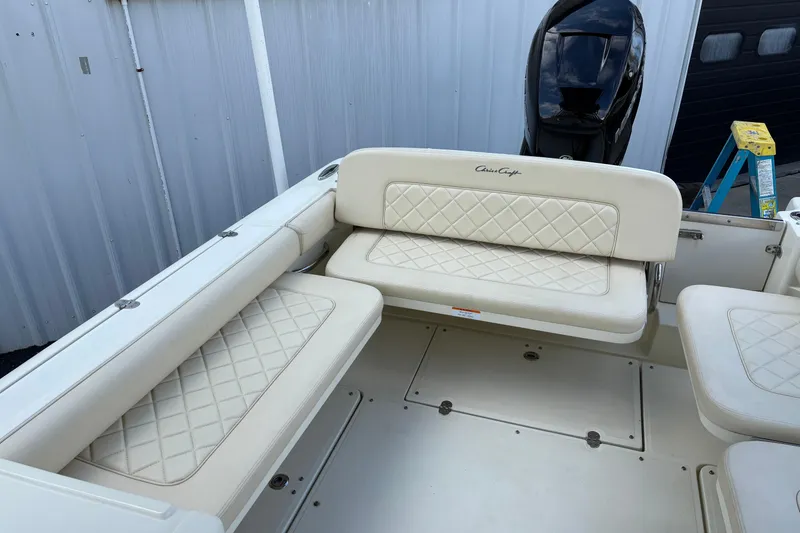 Slide: The Image of 2017 Chris-Craft Calypso 26 boat interior with cream quilted seating. - 38