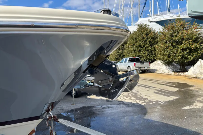 Slide: The Image of 2017 Chris-Craft Calypso 26 boat anchor detail in a marina setting. - 43