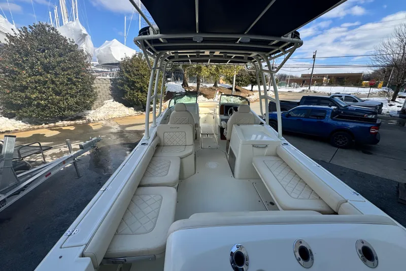 Slide: The Image of 2017 Chris-Craft Calypso 26 boat with spacious seating and elegant design. - 8