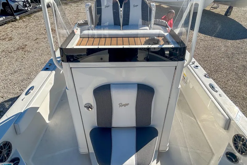 Slide: The Image of 2022 Ranger 2360 Bay boat interior with seating and console, showcasing modern design. - 10