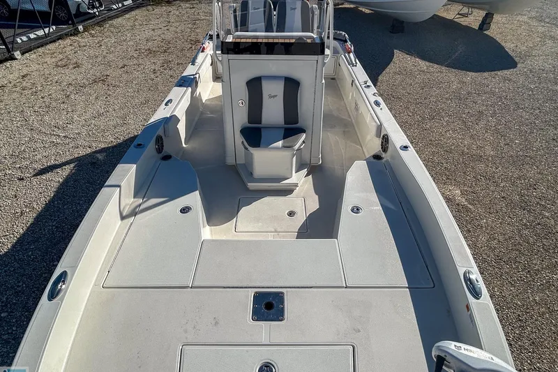 Slide: The Image of 2022 Ranger 2360 Bay boat interior with seating and storage compartments. - 13