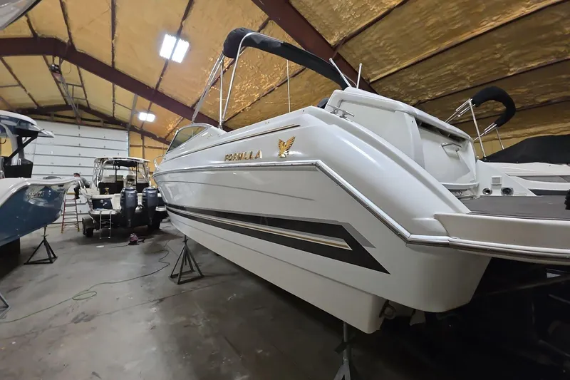 Slide: The Image of 2000 Formula 330 Sun Sport boat in indoor storage, side view. - 13
