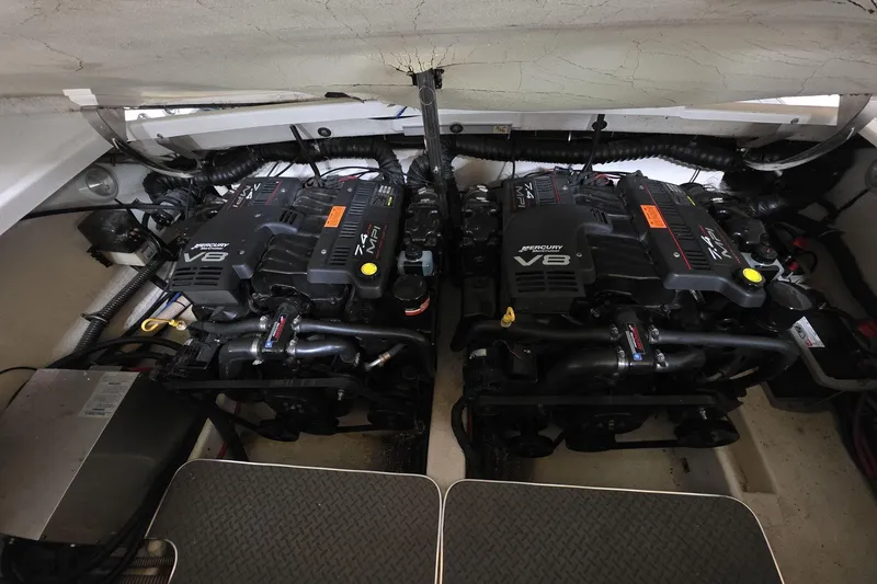 Slide: The Image of Twin Mercury V8 engines in a 2000 Formula 330 Sun Sport boat. - 16