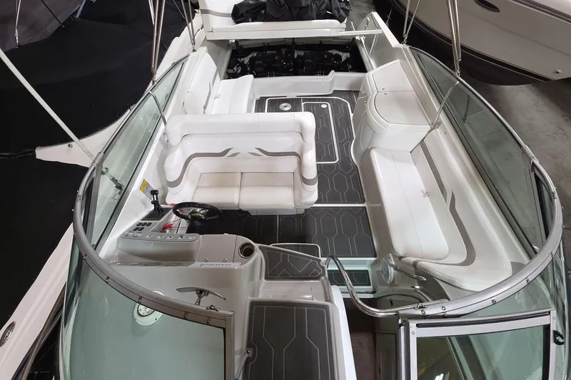 Slide: The Image of 2000 Formula 330 Sun Sport boat interior with white seating and modern dashboard. - 17