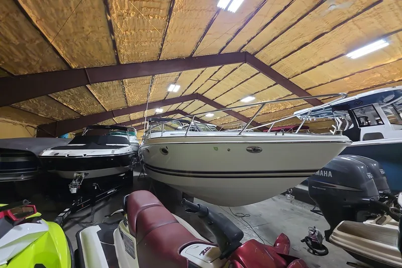Slide: The Image of 2000 Formula 330 Sun Sport boat in indoor storage with other vessels. - 3