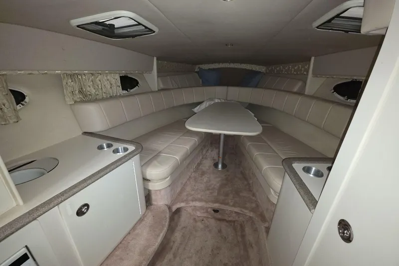 Slide: The Image of Interior of a 2000 Formula 330 Sun Sport boat with beige seating and table. - 7