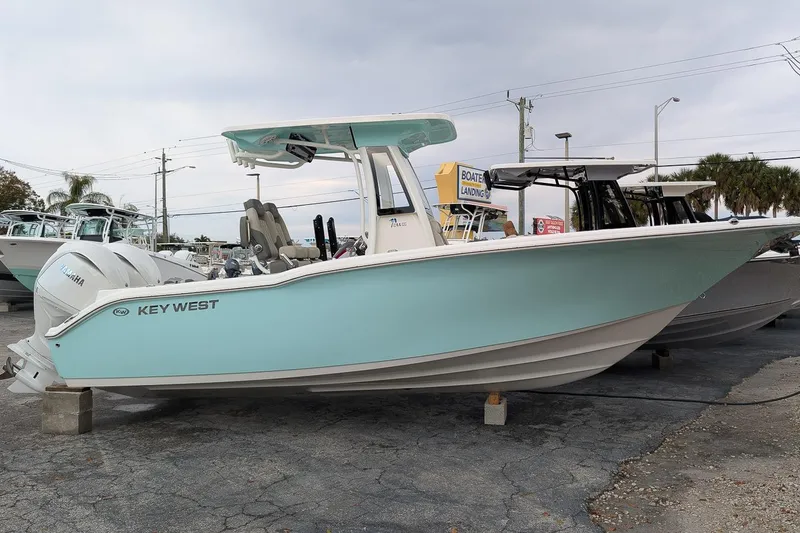 The Image of 2026 Key West 244 Center Console boat displayed outdoors on a lot. - 0