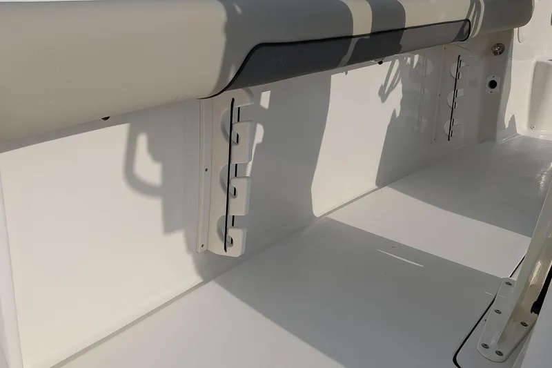Slide: The Image of 2026 Key West 244 Center Console boat interior with rod holders and seating. - 10
