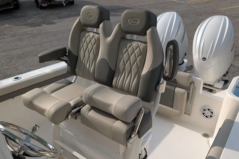 Slide: The Image of 2026 Key West 244 Center Console boat with luxurious seating and dual outboard engines. - 12