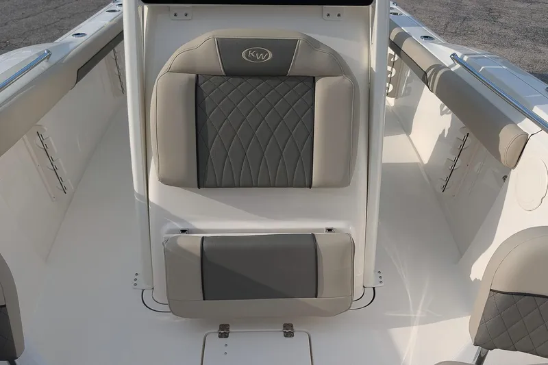 Slide: The Image of 2026 Key West 244 Center Console boat interior with cushioned seating and sleek design. - 15
