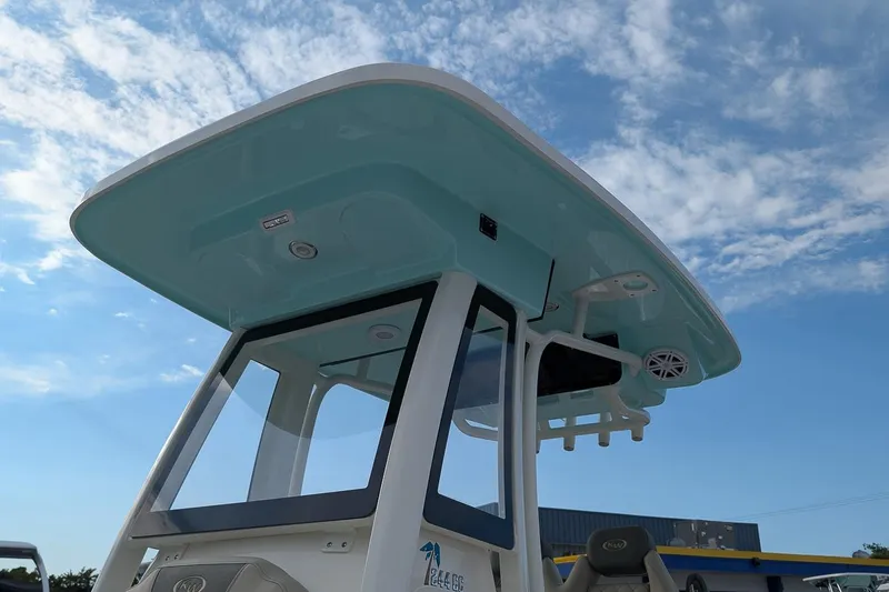 Slide: The Image of 2026 Key West 244 Center Console boat with sleek design under a clear blue sky. - 21