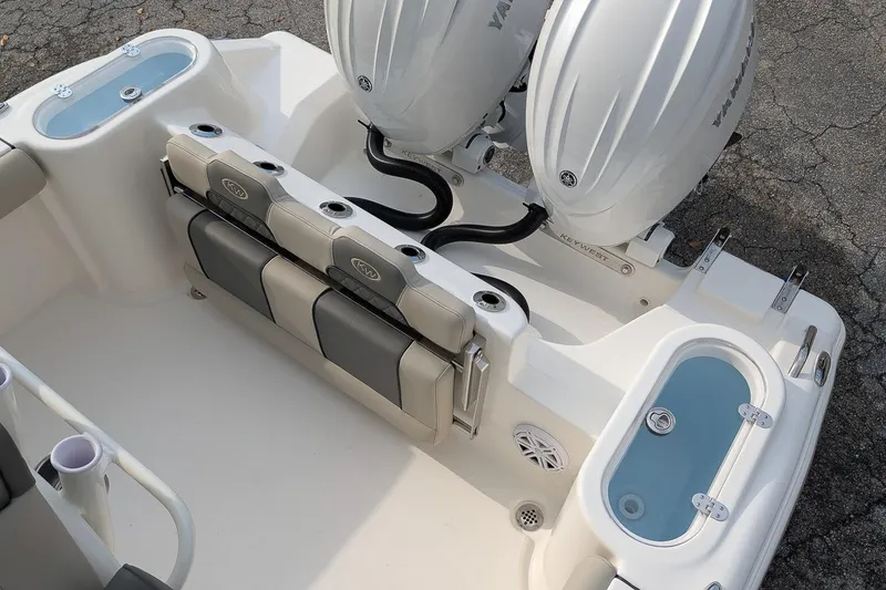 Slide: The Image of 2026 Key West 244 Center Console boat with dual engines and seating area. - 7