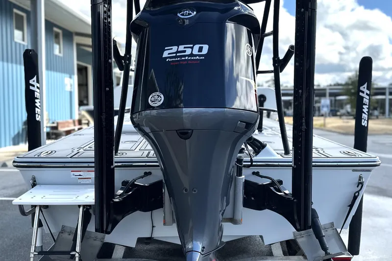 Slide: The Image of 2022 Hewes Redfisher 21 boat with Yamaha 250 outboard motor, docked outdoors. - 4