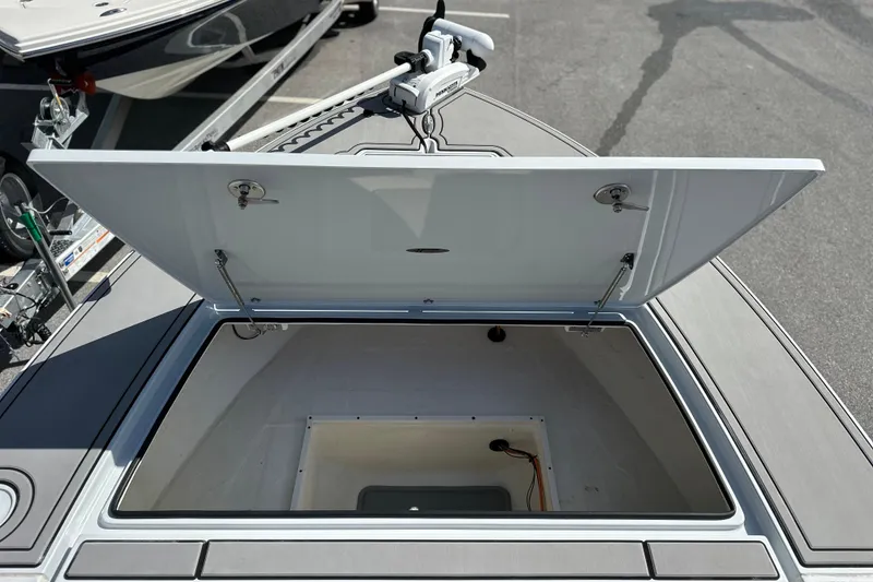 Slide: The Image of Open storage compartment on 2022 Hewes Redfisher 21 boat, showcasing interior space. - 9