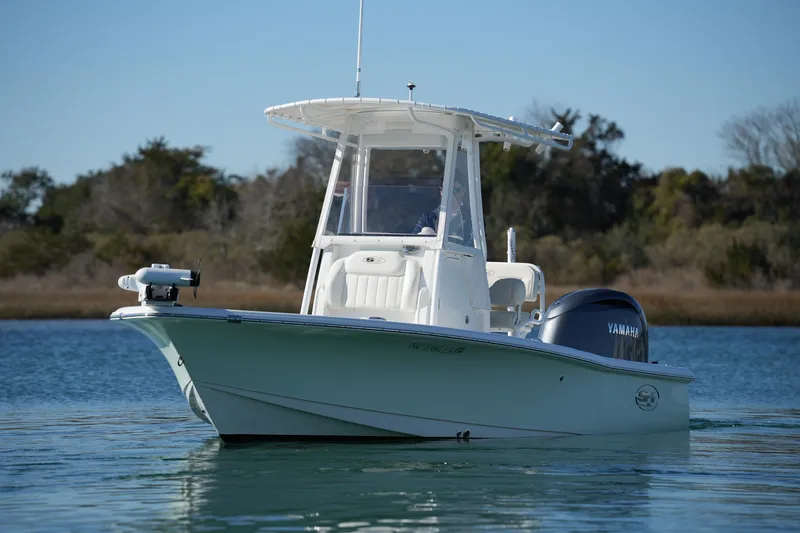 The Image of 2020 Sea Hunt BX 20 BR boat on calm water with Yamaha engine. - 0