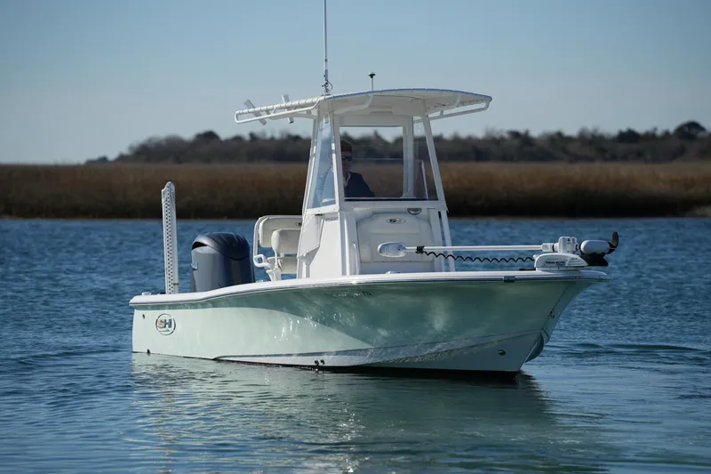 Slide: The Image of 2020 Sea Hunt BX 20 BR boat on calm water, featuring sleek design and modern equipment. - 11