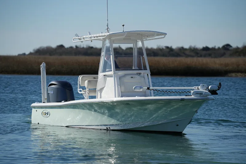 Slide: The Image of 2020 Sea Hunt BX 20 BR boat on calm water, featuring a Yamaha motor. - 12